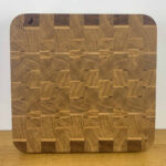 planche-bois-de-bout-plumes-seve-et-copeaux